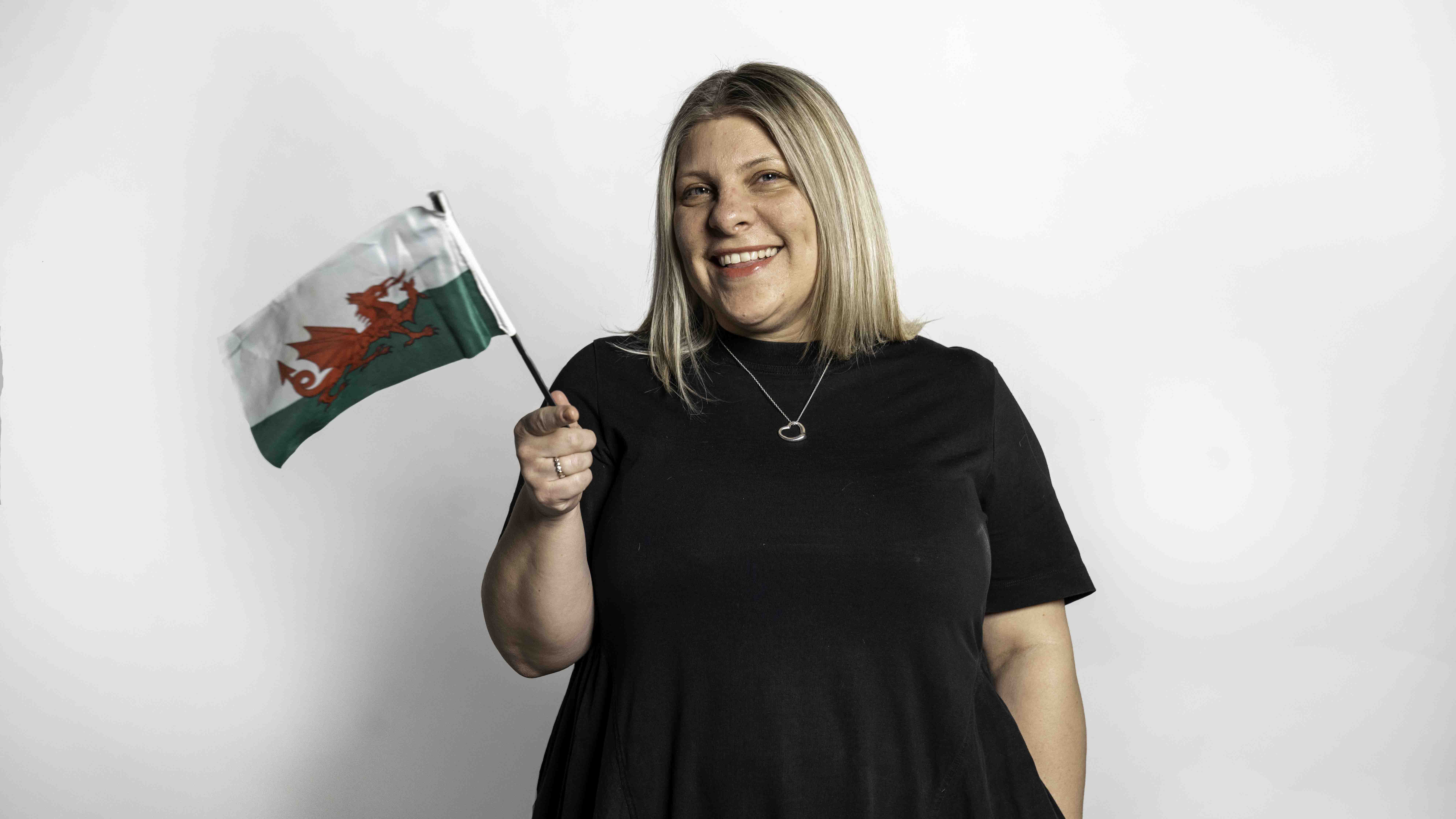 Jo waving a welsh flag